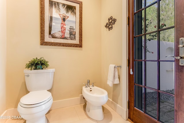 3 Ashford Lakes Dr, Ormond Beach, FL 32174 - bathroom featuring baseboards, toilet, a bidet, and tile patterned flooring