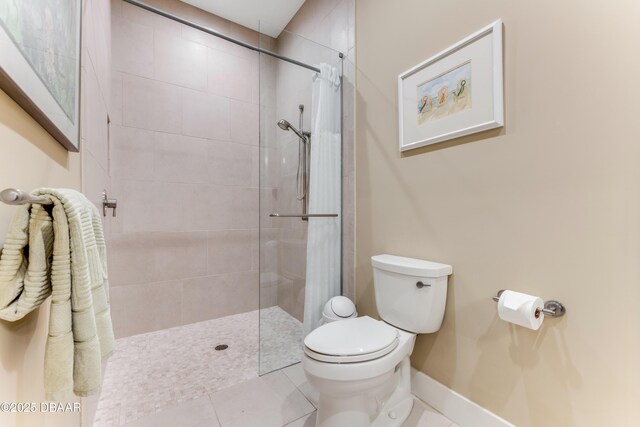 3 Ashford Lakes Dr, Ormond Beach, FL 32174 - full bath with toilet, tiled shower, tile patterned floors, and baseboards