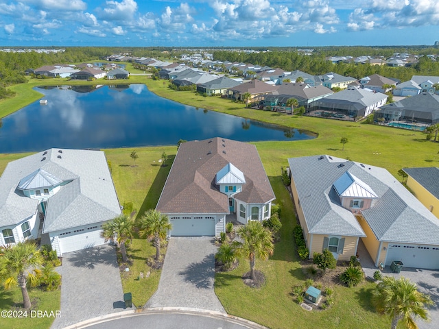 drone / aerial view with a water view