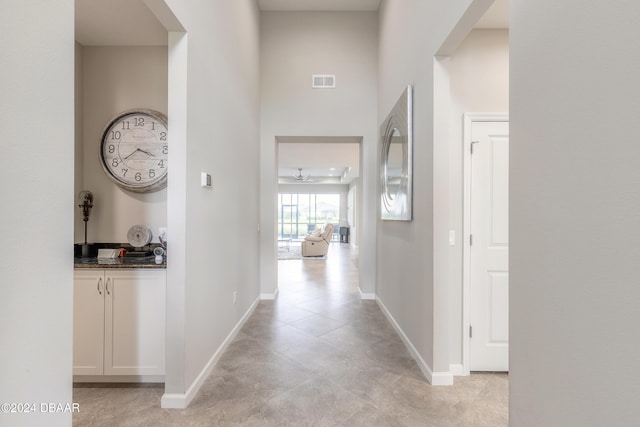 hallway with light tile patterned floors