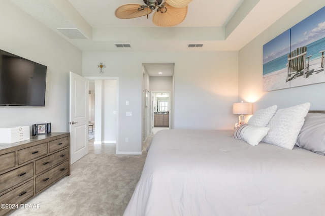 carpeted bedroom with ceiling fan and connected bathroom