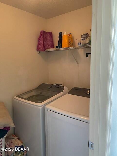 laundry area featuring washing machine and dryer