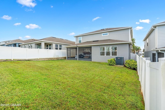 3404 Grassy Lake View Ave, Minneola, FL 34715 - back of house featuring a sunroom, central AC, a shingled roof, and stucco siding