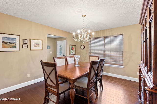 6 Leisure Wood Way, Ormond Beach, FL 32174 - dining space featuring a textured ceiling, baseboards, a chandelier, and dark wood finished floors