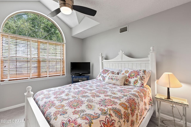 6 Leisure Wood Way, Ormond Beach, FL 32174 - carpeted bedroom featuring visible vents, a ceiling fan, vaulted ceiling with skylight, and baseboards