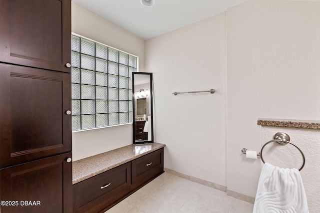 6 Leisure Wood Way, Ormond Beach, FL 32174 - bathroom with baseboards, a wealth of natural light, and tile patterned flooring