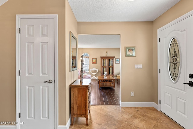 6 Leisure Wood Way, Ormond Beach, FL 32174 - entrance foyer with a textured ceiling and baseboards