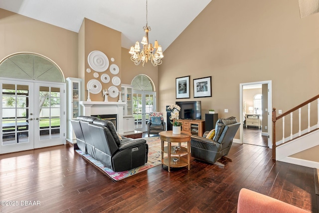 6 Leisure Wood Way, Ormond Beach, FL 32174 - living room with hardwood / wood-style flooring, stairway, an inviting chandelier, french doors, and high vaulted ceiling