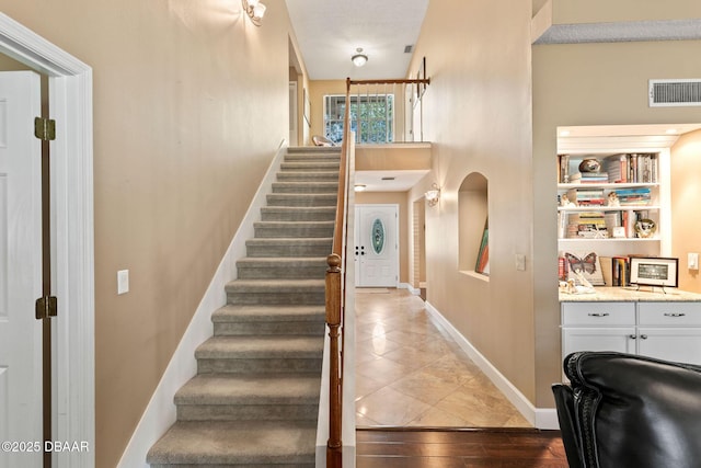 6 Leisure Wood Way, Ormond Beach, FL 32174 - tiled entryway with visible vents, stairway, and baseboards