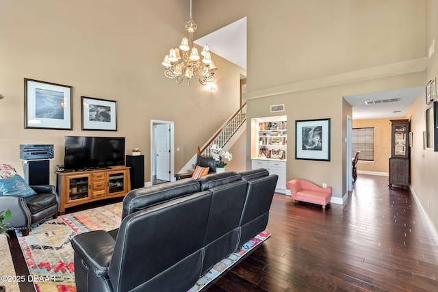 6 Leisure Wood Way, Ormond Beach, FL 32174 - living room with stairs, dark wood-style floors, visible vents, a notable chandelier, and a high ceiling