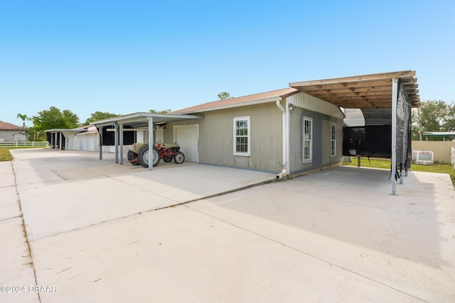 view of front of property with driveway and fence