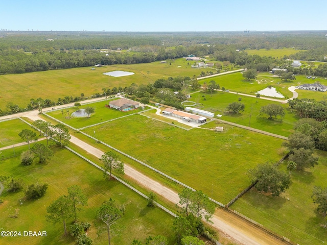 birds eye view of property featuring a rural view