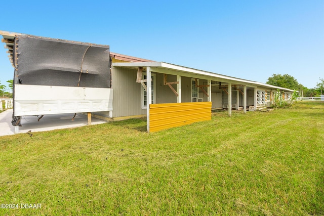 rear view of house with a yard