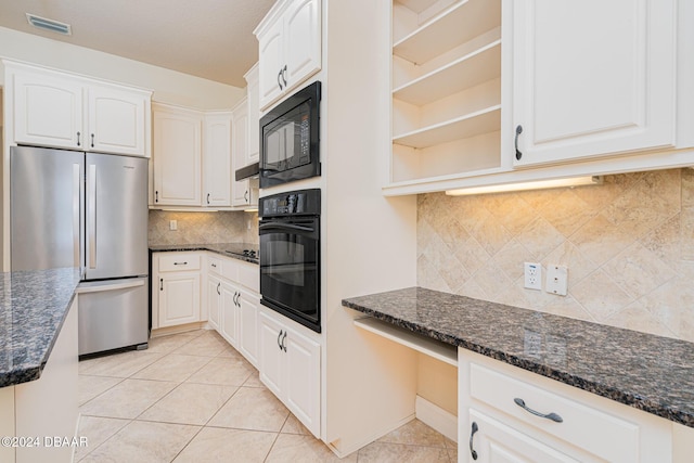 kitchen featuring visible vents, dark stone counters, light tile patterned flooring, black appliances, and open shelves