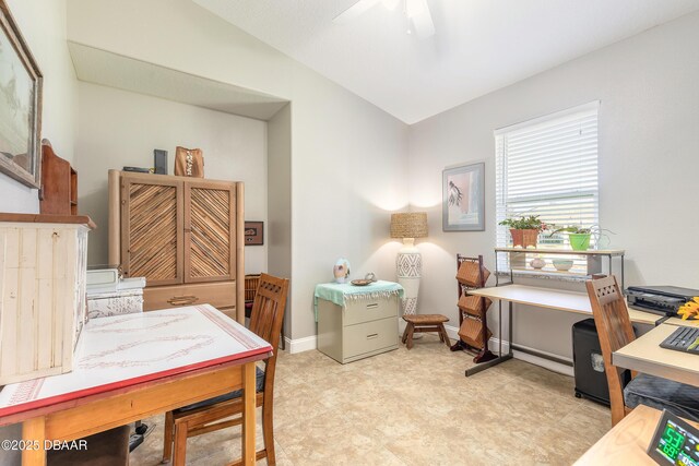 office area featuring ceiling fan and vaulted ceiling