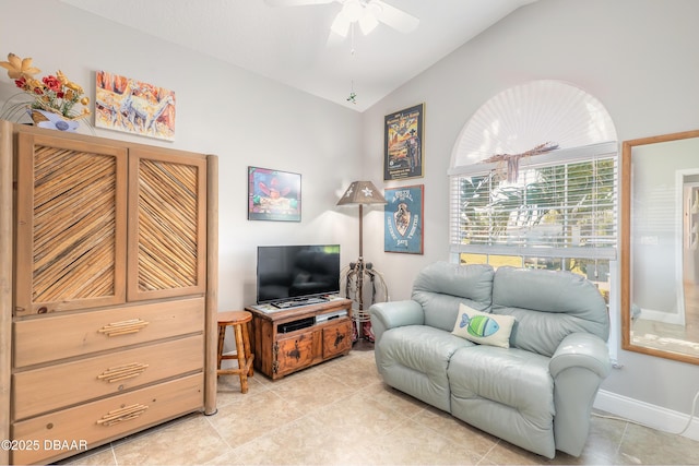 living room featuring ceiling fan and lofted ceiling