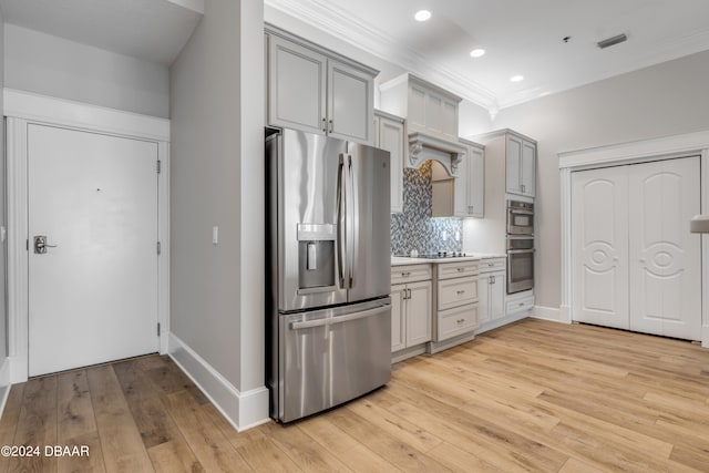 kitchen featuring light hardwood / wood-style floors, gray cabinetry, and appliances with stainless steel finishes