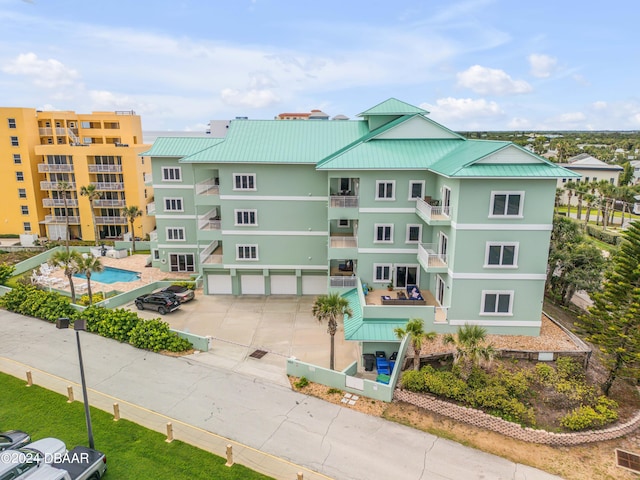 view of property featuring a community pool