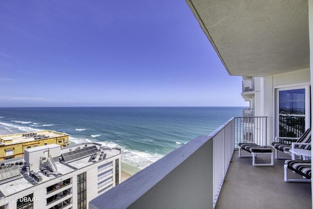 balcony featuring a water view