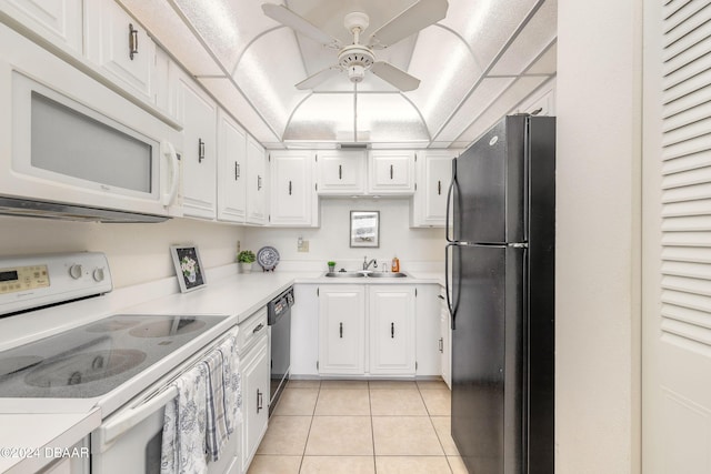 kitchen with light tile patterned floors, white cabinetry, ceiling fan, black appliances, and sink