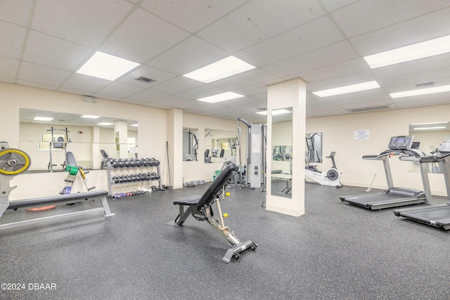 workout area featuring a drop ceiling