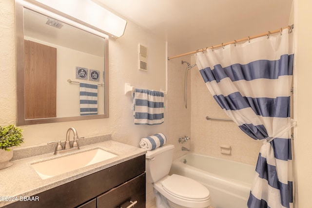 full bathroom with toilet, vanity, and shower / bath combo with shower curtain