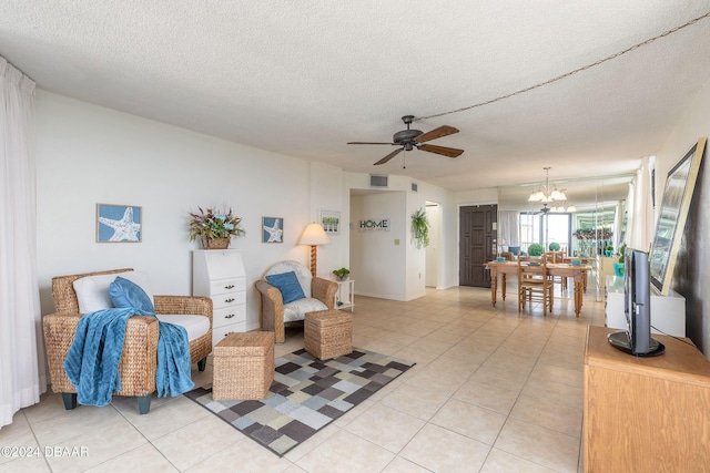 1415 Ocean Shore Blvd Unit 1111, Ormond Beach, FL 32176 - living area with a chandelier, a ceiling fan, light tile patterned floors, and a textured ceiling