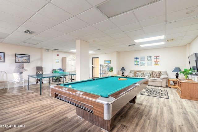 rec room featuring wood-type flooring and a drop ceiling