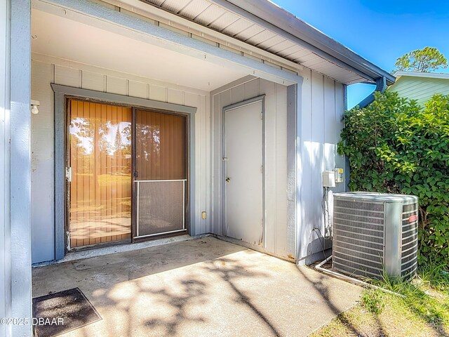 1104 Monticello Ln Unit 4, Port Orange, FL 32129 - view of exterior entry with central AC unit