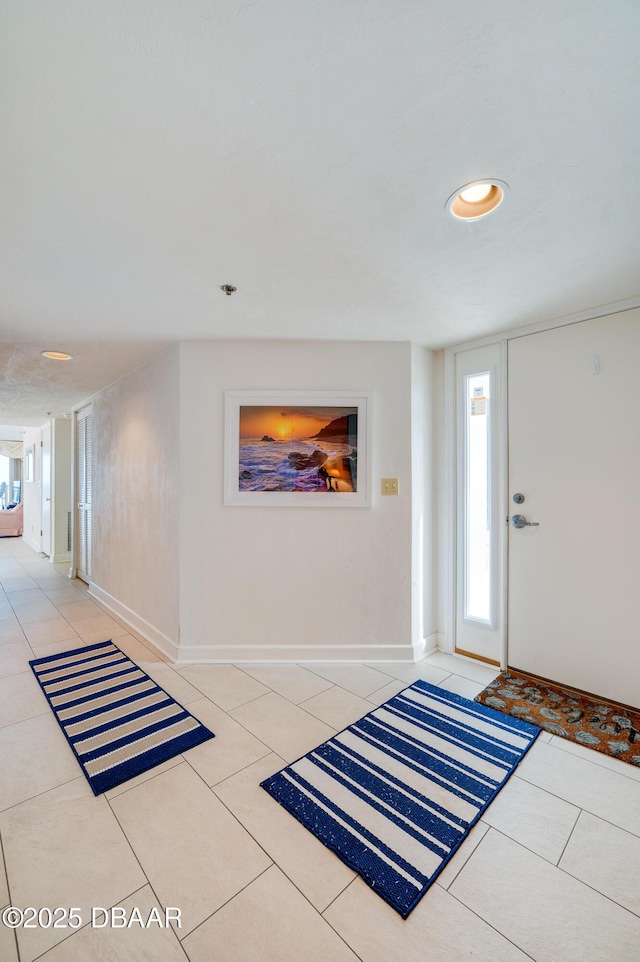 foyer featuring light tile patterned floors