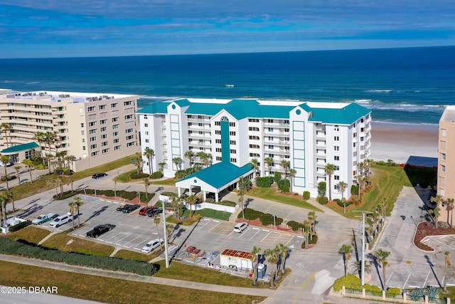 bird's eye view with a view of the beach and a water view