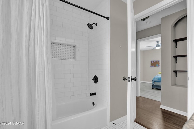 bathroom featuring wood-type flooring, ceiling fan, and shower / bathtub combination with curtain