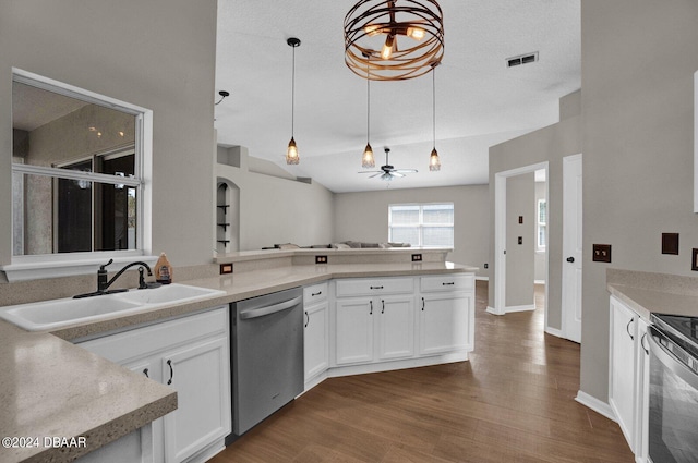 kitchen featuring stainless steel appliances, white cabinetry, pendant lighting, and dark wood-type flooring