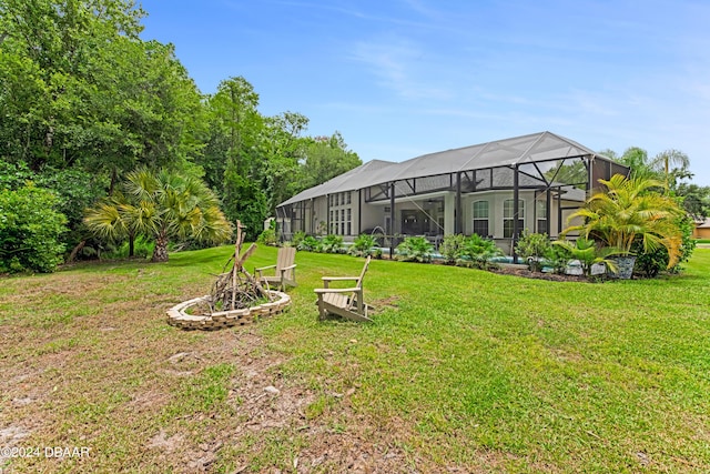 view of yard featuring glass enclosure