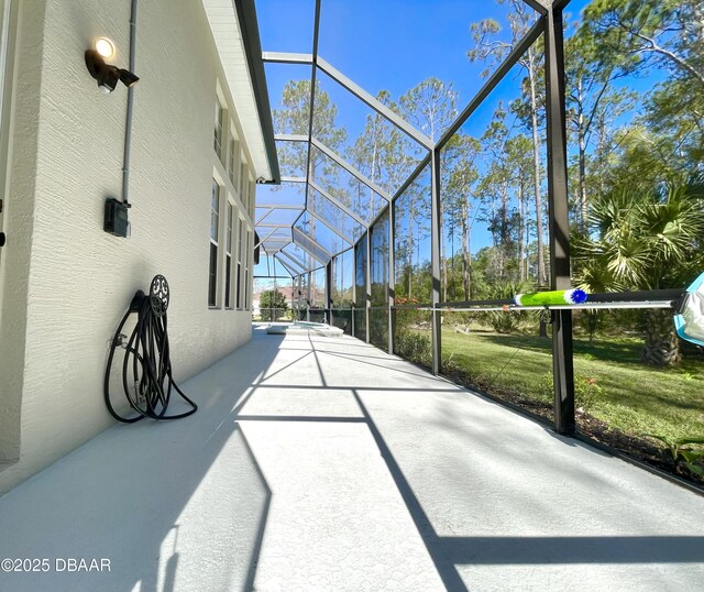 view of patio / terrace featuring a lanai, grilling area, and ceiling fan