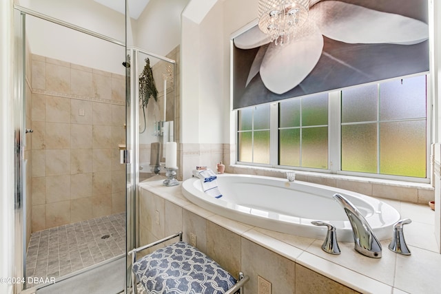 bathroom featuring separate shower and tub