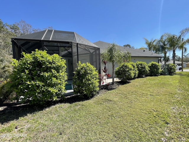 view of yard featuring a lanai