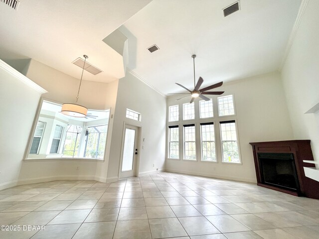 dining room featuring light tile patterned floors, baseboards, a ceiling fan, and a sunroom