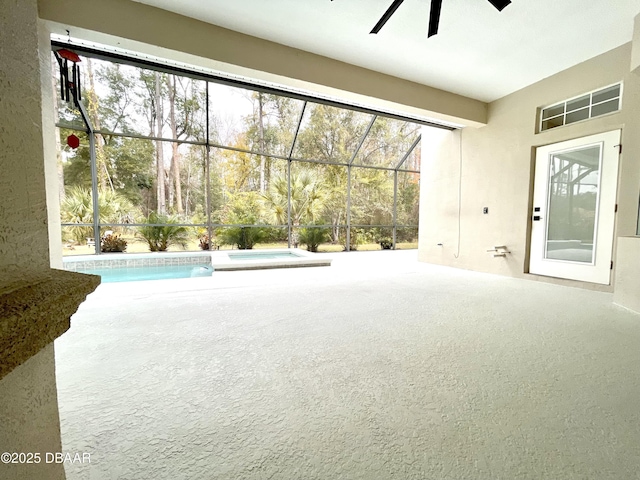 interior space featuring ceiling fan and carpet