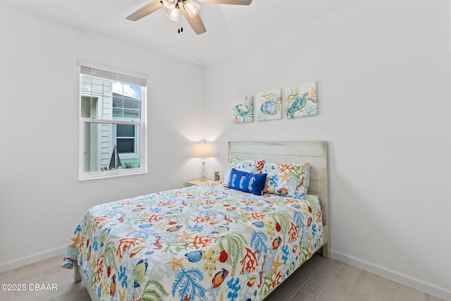 bedroom with hardwood / wood-style flooring and ceiling fan