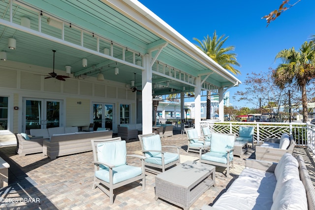 view of patio featuring an outdoor hangout area and ceiling fan