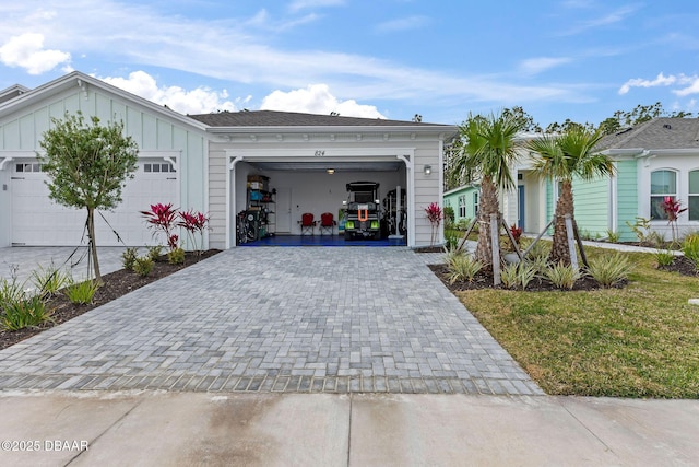 ranch-style house featuring a garage and a front yard