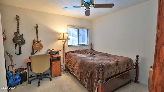 carpeted bedroom with a textured ceiling and ceiling fan