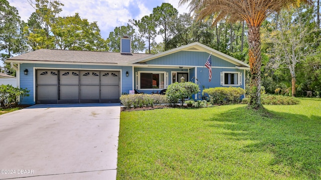 single story home featuring a garage and a front yard