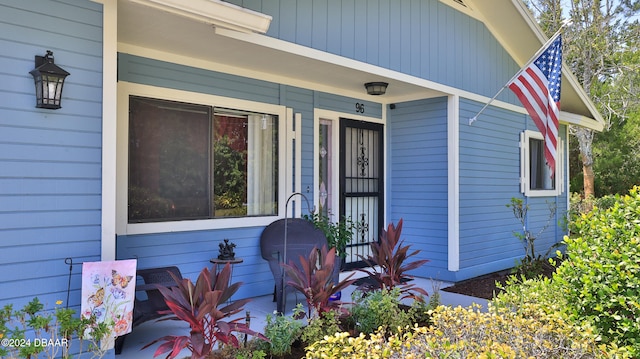 doorway to property with a porch