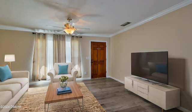 living room featuring ceiling fan, dark hardwood / wood-style flooring, and ornamental molding