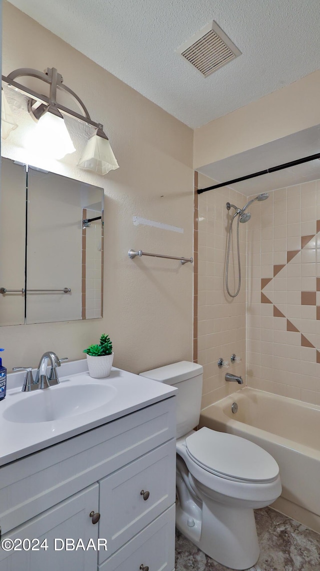 1107 Viking Dr, Port Orange, FL 32129 - bathroom with vanity, toilet, shower / bathtub combination, and a textured ceiling