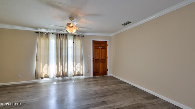 1107 Viking Dr, Port Orange, FL 32129 - unfurnished room featuring ornamental molding, wood finished floors, ceiling fan, and baseboards