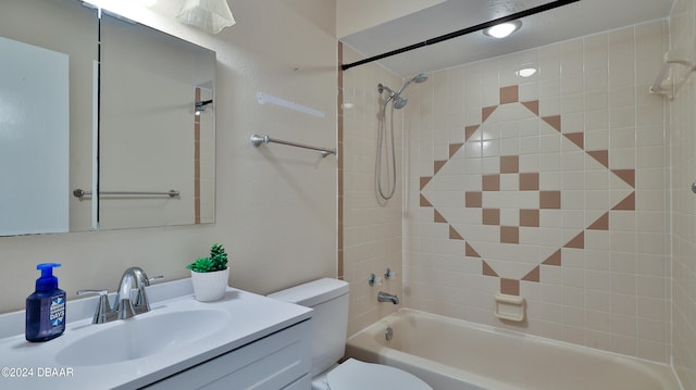 full bathroom with vanity, toilet, and tiled shower / bath combo