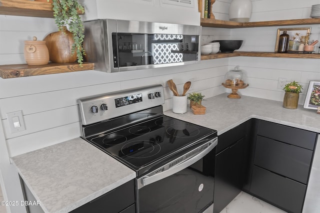 kitchen with appliances with stainless steel finishes and decorative backsplash